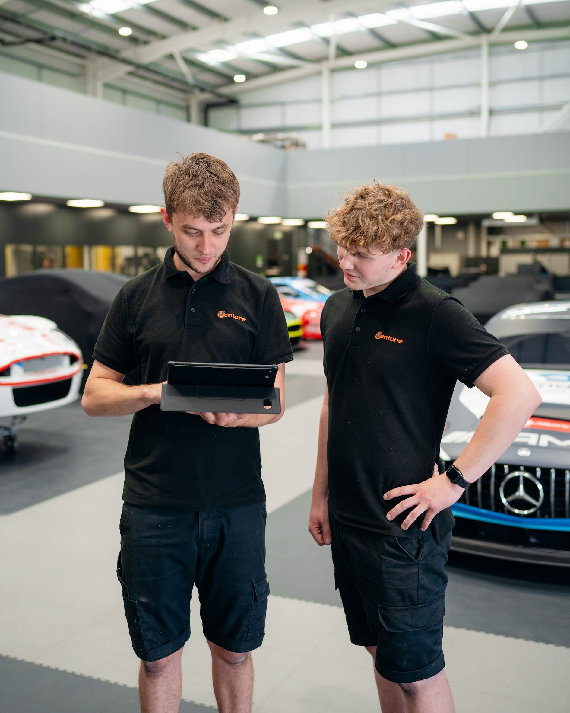 venture engineering staff looking at Acumatica for manufacturing on ipad